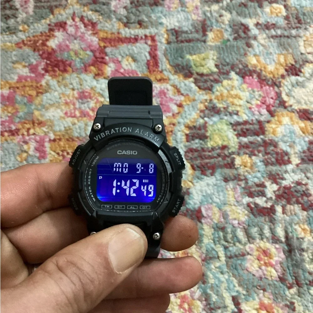 Casio Black Digital Vibration Alarm Watch with Blue Accent